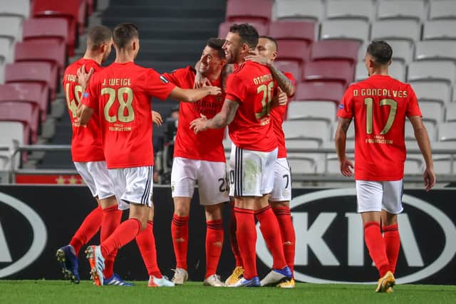 Benfica celebrate after scoring against Belgian club Standard Liege (Photo by VIRGINIE LEFOUR/BELGA MAG/AFP via Getty Images)