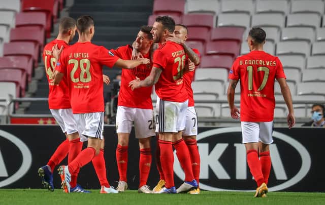 Benfica celebrate after scoring against Belgian club Standard Liege (Photo by VIRGINIE LEFOUR/BELGA MAG/AFP via Getty Images)