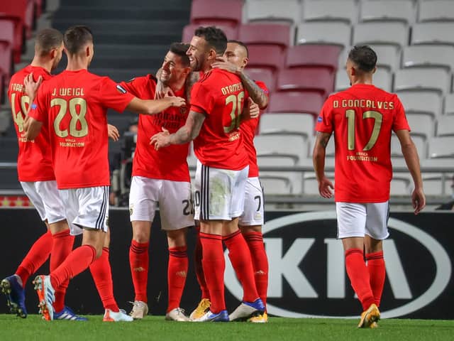 Benfica celebrate after scoring against Belgian club Standard Liege  (Photo by VIRGINIE LEFOUR/BELGA MAG/AFP via Getty Images)