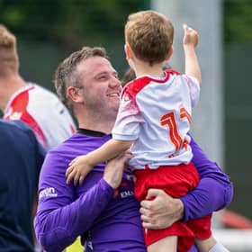 Spartans' Blair Carswell celebrates with young Ollie after defeating Dundee United.