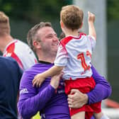 Spartans' Blair Carswell celebrates with young Ollie after defeating Dundee United.