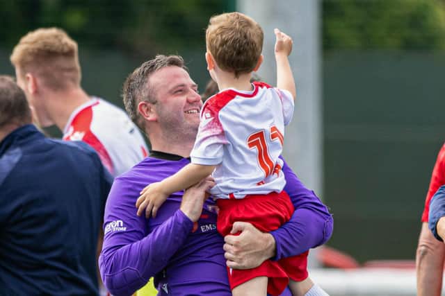 Spartans' Blair Carswell celebrates with young Ollie after defeating Dundee United.