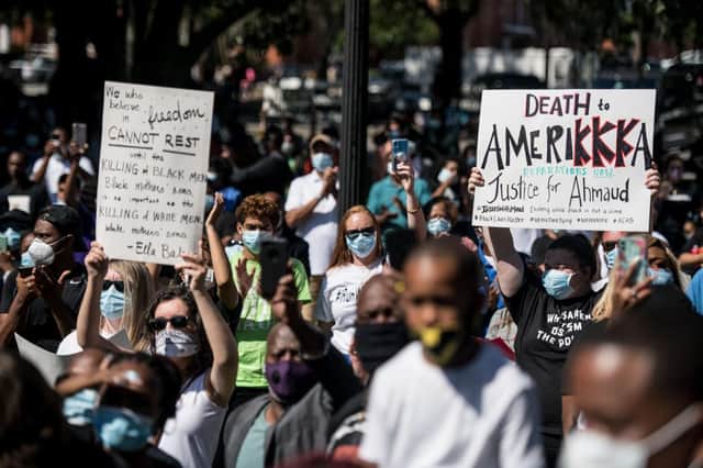 Demonstrators protested the shooting death of Ahmaud Arbery on May 8, following the arrests of Gregory McMichael and Travis McMichael (Getty Images)
