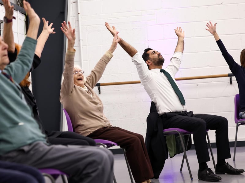 Humza Yousaf takes part in a dance performance during a visit to the Edinburgh Community Performing Arts re-connect project