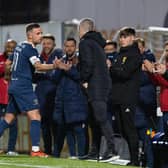 Raith's Lewis Vaughan shakes hands with Hibs manager Nick Montgomery during the testimonial match at Stark's Park. (Photo by Ross Parker / SNS Group)