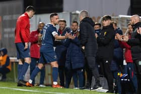 Raith's Lewis Vaughan shakes hands with Hibs manager Nick Montgomery during the testimonial match at Stark's Park. (Photo by Ross Parker / SNS Group)