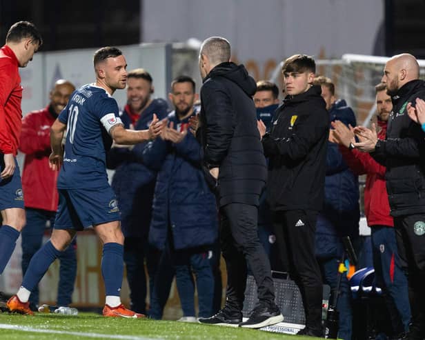 Raith's Lewis Vaughan shakes hands with Hibs manager Nick Montgomery during the testimonial match at Stark's Park. (Photo by Ross Parker / SNS Group)