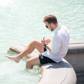 A man paddles in the fountain in Trafalgar Square, central London, as Britons are set to experience the hottest UK day on record as temperatures are predicted to hit 40C. Picture date: Tuesday July 19, 2022.