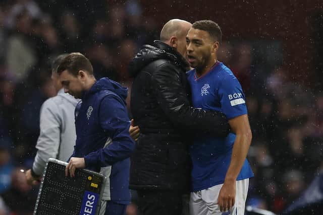 Philippe Clement speaks to Cyriel Dessers during Rangers' win over Dundee.