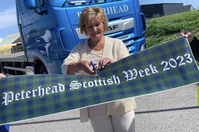 Scottish Week president, Elaine Cay, officially cuts the ribbon to open the gala week.