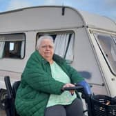 Joann Beattie next to the abandoned caravan in Johnshaven