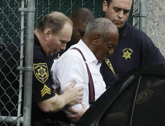 Bill Cosby departs in handcuffs to begin a three-to-10 year prison sentence for sexual assault. Now, the highest court has overturned comedian Cosby's sex assault conviction. The court said Wednesday, June 30, that they found an agreement with a previous prosecutor prevented him from being charged in the case.  (AP Photo/Matt Slocum, File)