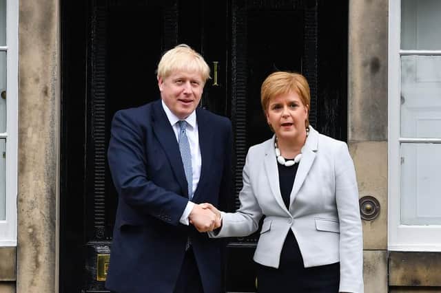 Nicola Sturgeon and Boris Johnson both need to demonstrate greater urgency over a public inquiry into the Covid pandemic (Picture: Jeff J Mitchell/Getty Images)