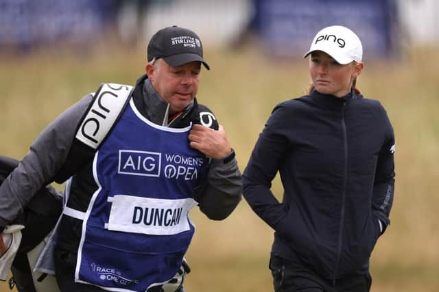 Dean Robertson walks with Louise Duncan during the AIG Women's Open at Muirfield. Picuture: Charlie Crowhurst/Getty Images.