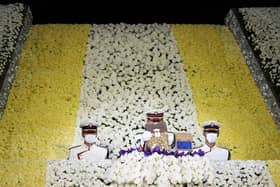 Honour guards carry the urn containing the ashes of Japan's former prime minister Shinzo Abe from the altar at the end of his state funeral in the Nippon Budokan in Tokyo on September 27, 2022. FRANCK ROBICHON/POOL/AFP via Getty Images