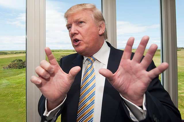 Donald Trump, seen at his Turnberry resort in Ayrshire, is facing serious questions about his tax affairs following revelations in the New York Times (Picture: John Devlin)