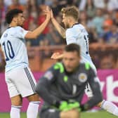 Scotland's Stuart Armstrong, right, celebrates with Che Adams after scoring his side's first goal against Armenia.