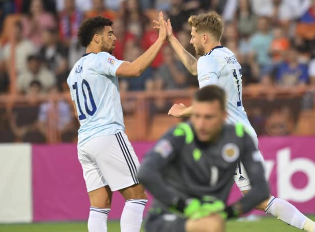 Scotland's Stuart Armstrong, right, celebrates with Che Adams after scoring his side's first goal against Armenia.