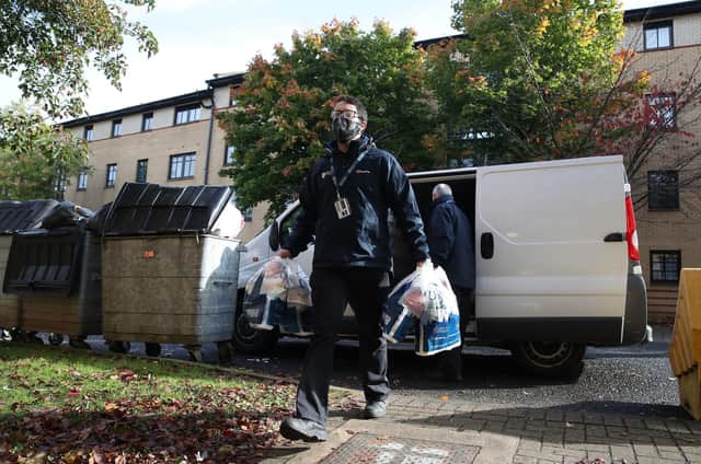 Food parcels are handed out by the University of Glasgow to students staying at the Murano Street Student Village. Picture: Andrew Milligan/PA Wire