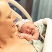 Mother with her new born baby girl in the hospital.