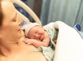 Mother with her new born baby girl in the hospital.