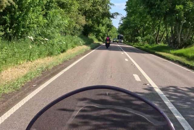 The police vehicle can clearly be seen on the opposite side of the road, despite the solid white lines. Pic: SWD Media.