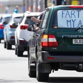 Anger: a sign in a vehicle during a protest against the government's plans to tax emissions from farm animals in New Zealand (Photo: Marty Melville/ Getty Images)