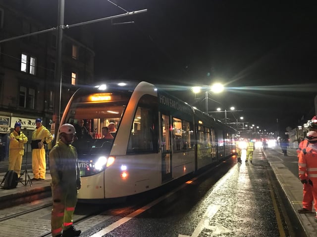 Trams running through the night in Leith