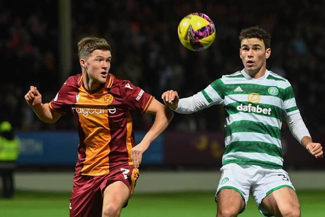Motherwell's Blair Spittal and Celtic's Matt O'Riley during a Premier Sports Cup match between Motherwell and Celtic at Fir Park, on October 19, 2022, in Motherwell, Scotland. (Photo by Craig Foy / SNS Group)