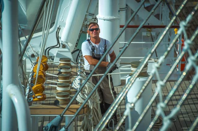 A crew-member on the deck of Tradewind Voyages ship, Golden Horizon, the world's largest square-rigged sailing ship.