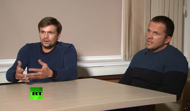 Ruslan Boshirov, left, and Alexander Petrov attend their first public appearance in an interview with the Kremlin-funded RT channel in Moscow, Russia. Picture: RT channel video via AP