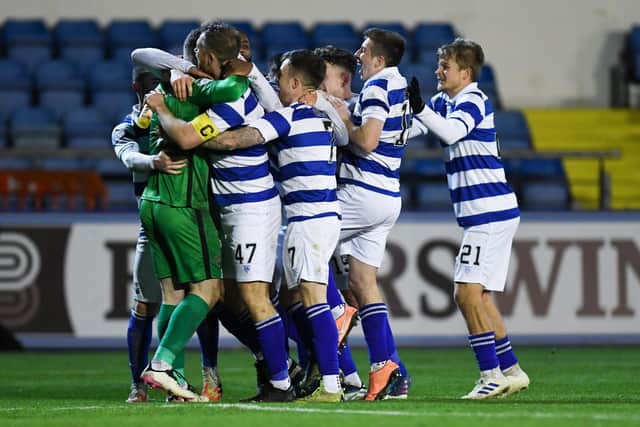 The Morton players celebrate with goalkeeper Jack Hamilton after their penalty shootout victory against Inverness.