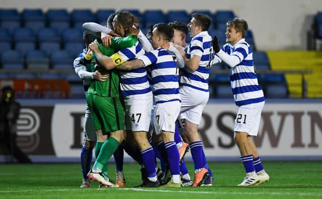 The Morton players celebrate with goalkeeper Jack Hamilton after their penalty shootout victory against Inverness.