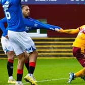 Rangers' Cyriel Dessers and Motherwell's Mika Biereth pull each others shirt. (Photo by Alan Harvey / SNS Group)