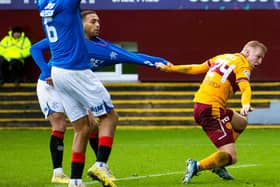 Rangers' Cyriel Dessers and Motherwell's Mika Biereth pull each others shirt. (Photo by Alan Harvey / SNS Group)