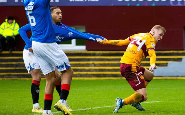 Rangers' Cyriel Dessers and Motherwell's Mika Biereth pull each others shirt. (Photo by Alan Harvey / SNS Group)