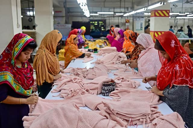 Women work at a garment factory in Savar, on the outskirts of Dhaka, earlier this month. The tenth anniversary of the Rana Plaza garment building collapse will be marked on April 24, a catastrophe that spotlighted the global fashion industry's reliance on developing world labour, working in dangerous and sometimes deadly conditions. Picture: AFP via Getty Images