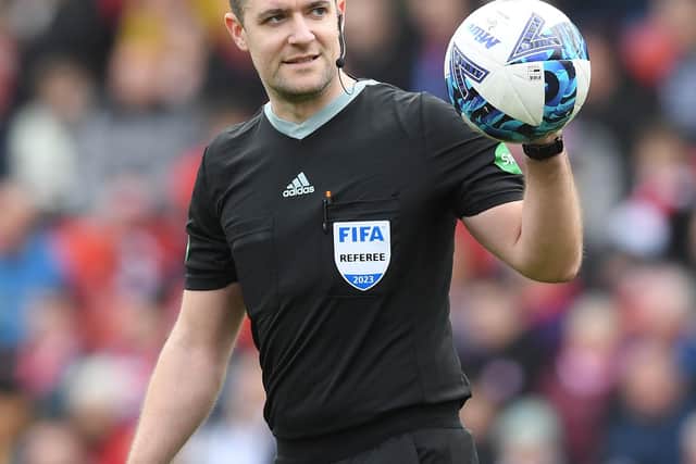 Referee Don Robertson takes charge of the Viaplay Cup final/