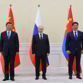 China's President Xi Jinping, Russian President Vladimir Putin and Mongolia's President Ukhnaa Khurelsukh hold a trilateral meeting on the sidelines of the Shanghai Cooperation Organisation leaders' summit in Samarkand. Picture: AFP via Getty Images