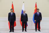 China's President Xi Jinping, Russian President Vladimir Putin and Mongolia's President Ukhnaa Khurelsukh hold a trilateral meeting on the sidelines of the Shanghai Cooperation Organisation leaders' summit in Samarkand. Picture: AFP via Getty Images