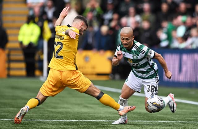 Celtic's Daizen Maeda skips past Jamie Brandon during the 3-0 win over Livingston at the Tony Macaroni Arena. (Photo by Paul Devlin / SNS Group)
