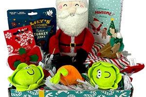 The Postman Pooch Christmas Dog Toy and Treat Gift Box has a wide selection of festive-themed doggy chews and squeaky toys. It's an entire Christmas stocking that's suitable for all dogs aged over fout months. It's priced at ÂŁ18 and available from Pets At Home.
