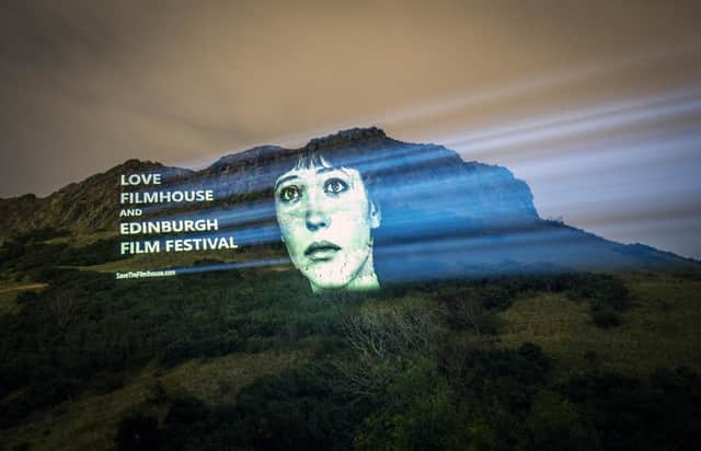 An image of actor Anna Karina from the film Vivre Sa Vie was projected on Salisbury Crags in Edinburgh as part of a campaign to save the Filmhouse cinema and the Edinburgh International Film Festival (Picture: Jane Barlow/PA)