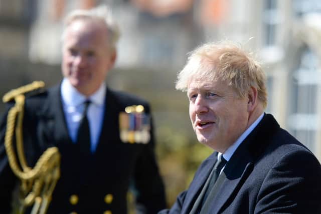 British Prime Minister Boris Johnson (right) attends a Passing-out parade at Britannia Royal Naval College, in Dartmout. Picture: Finnbarr Webster/POOL/AFP via Getty Images