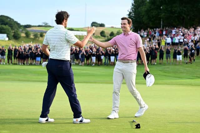Rasmus Hojgaard, right, is congratulated by Nacho Elvira after winning a six-hole play-off to become the first home winner of the Made in HimmerLand at Himmerland Golf & Spa Resort in Denmark. Picture: Octavio Passos/Getty Images.
