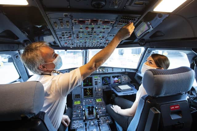 Director of Flight Operations Captain David Morgan and Captain Kate McWilliams in the cockpit of easyJet flight EZY883 before it takes-off from London Gatwick bound for Glasgow
