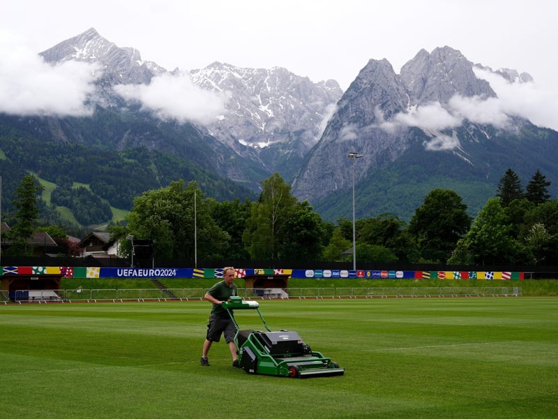A groundsman prepares the facilities at Stadion am Groben, Scotland's training ground in Garmisch-Partenkirchen, ahead of the team's arrival for the beginning of their Euro 2024 campaign.