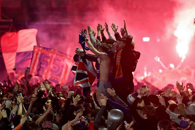 Rangers fans gather in Glasgow's George Square to celebrate the club winning the Scottish Premiership for the first time in 10 years (Picture: Jeff J Mitchell/Getty Images)
