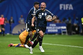 Argentina's Alexis Mac Allister celebrates after Enzo Fernandez scored his team's first goal in the 2-1 win over England. MacAllister can trace his ancestry back to Fife (Picture: Paul Ellis/AFP via Getty Images)