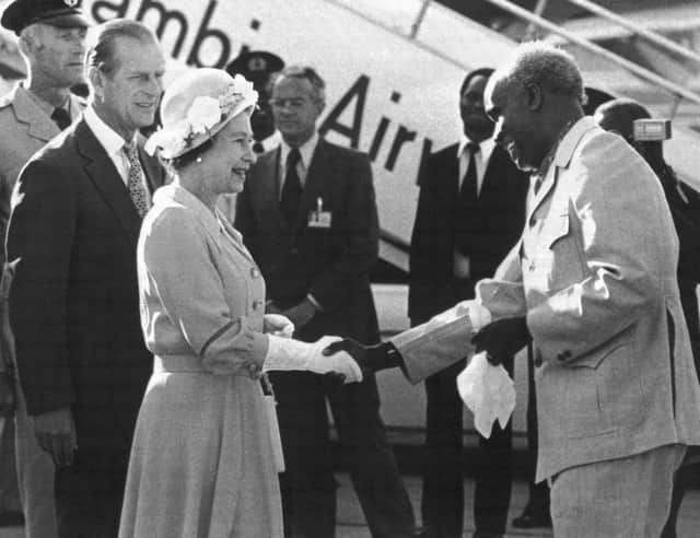 In this July 29, 1979 file photo, Zambia's President Kenneth Kaunda greets Britain's Queen Elizabeth II upon her arrival in Lusaka, Zambia on the final leg of her four-nation African tour. Zambiaâ€™s first president Kenneth Kaunda has died at the age of 97, the country's president Edward Lungu announced Thursday June 17, 2021. (AP Photo/File)
